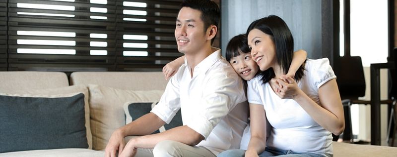 happy asian family of three - man, woman, and daughter - SingSaver