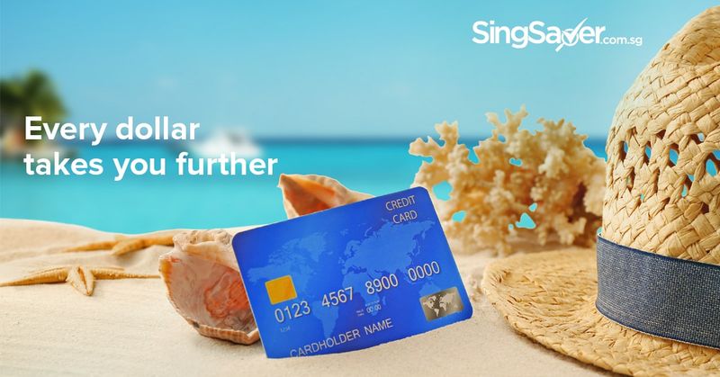 credit card displayed on a sand beach