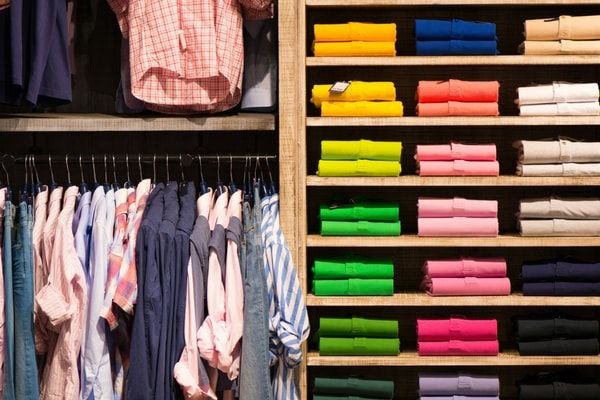 men clothes arranged in wardrobe