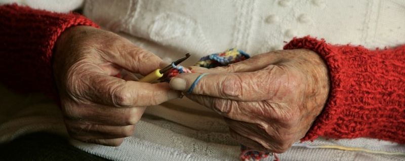 retiree knitting hands