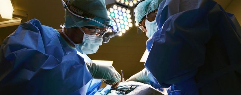surgeons carrying out an operation - SingSaver 